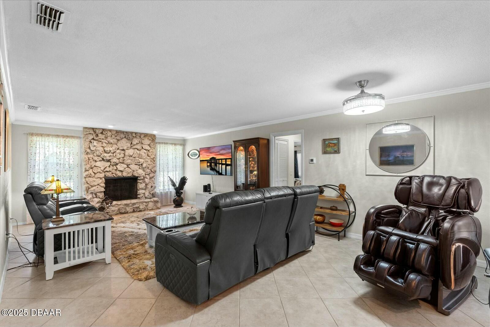 1 Cobblestone Trail Ormond Beach, FL 32174 - Photo 9 of 31 a living room with furniture fireplace and flat screen tv