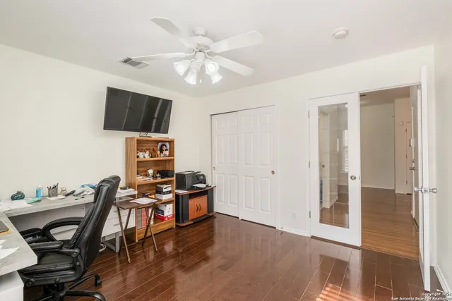 a view of a livingroom with furniture and a flat screen tv