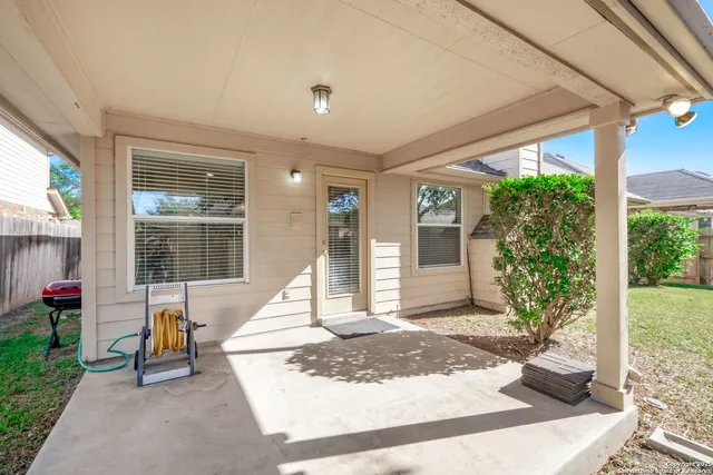 a building exterior with stairs and bench
