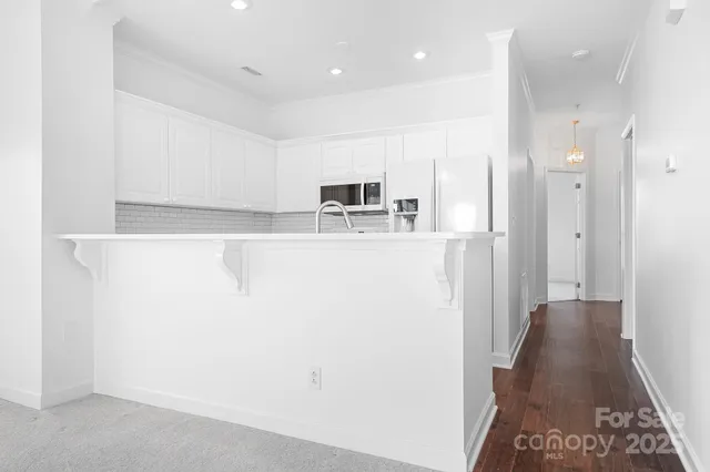 a view of an empty room and glass door
