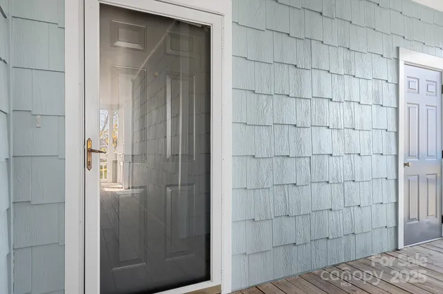 a view of a balcony with wooden floor