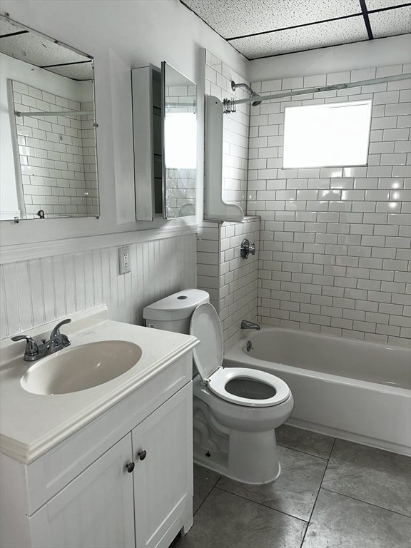 189 5th Street, Unit 2 Fall River, MA 02721 - Photo 14 of 18 a bathroom with a sink a toilet and shower