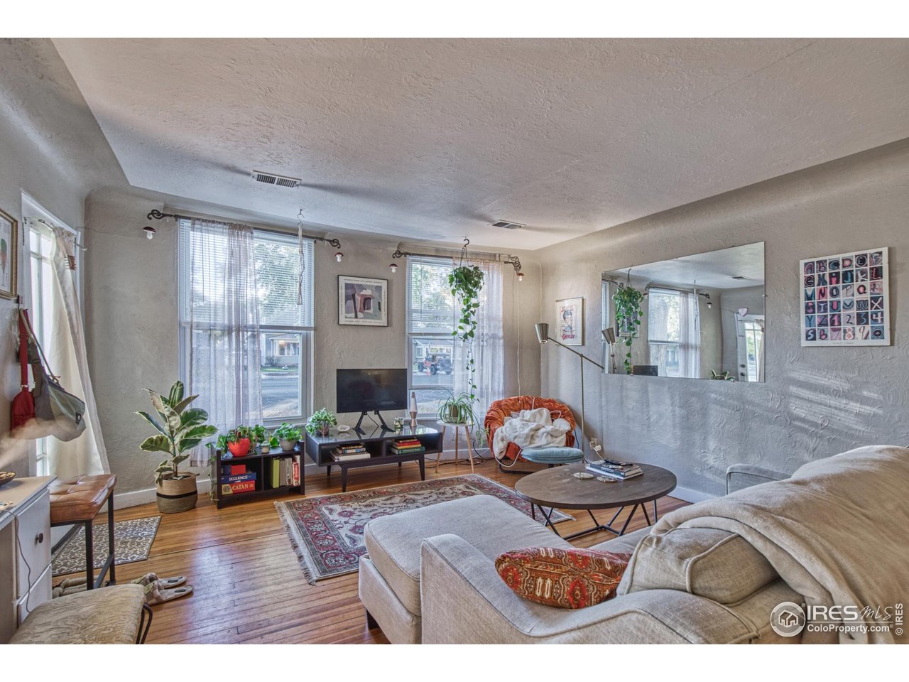 530 Mathews Street Fort Collins, CO 80524 - Photo 6 of 39 a living room with furniture and a flat screen tv