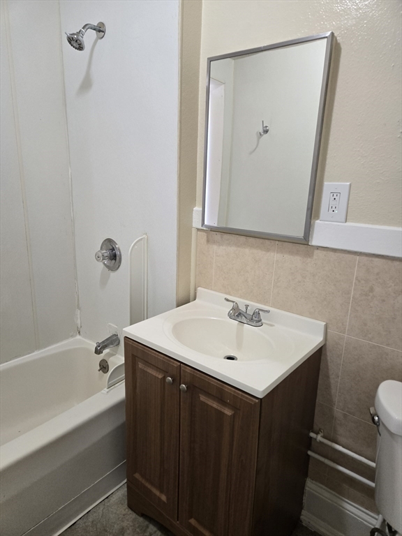 240 Locust Street, Unit 4L Springfield, MA 01108 - Photo 4 of 12 a bathroom with a sink and a mirror