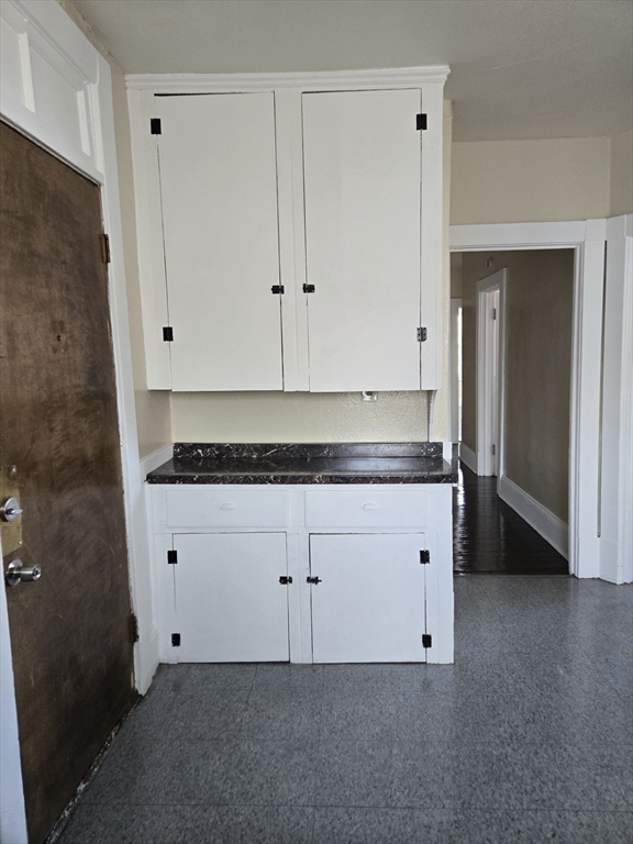 240 Locust Street, Unit 4L Springfield, MA 01108 - Photo 5 of 12 a room with cabinets