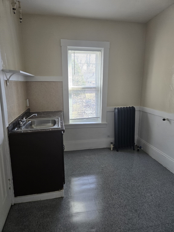 240 Locust Street, Unit 4L Springfield, MA 01108 - Photo 7 of 12 a view of an empty room with a window