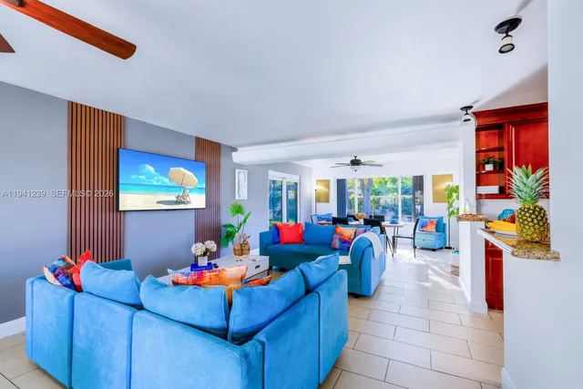 a bedroom with a bed and a potted plant