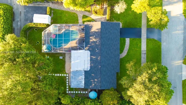an aerial view of a house with a garden