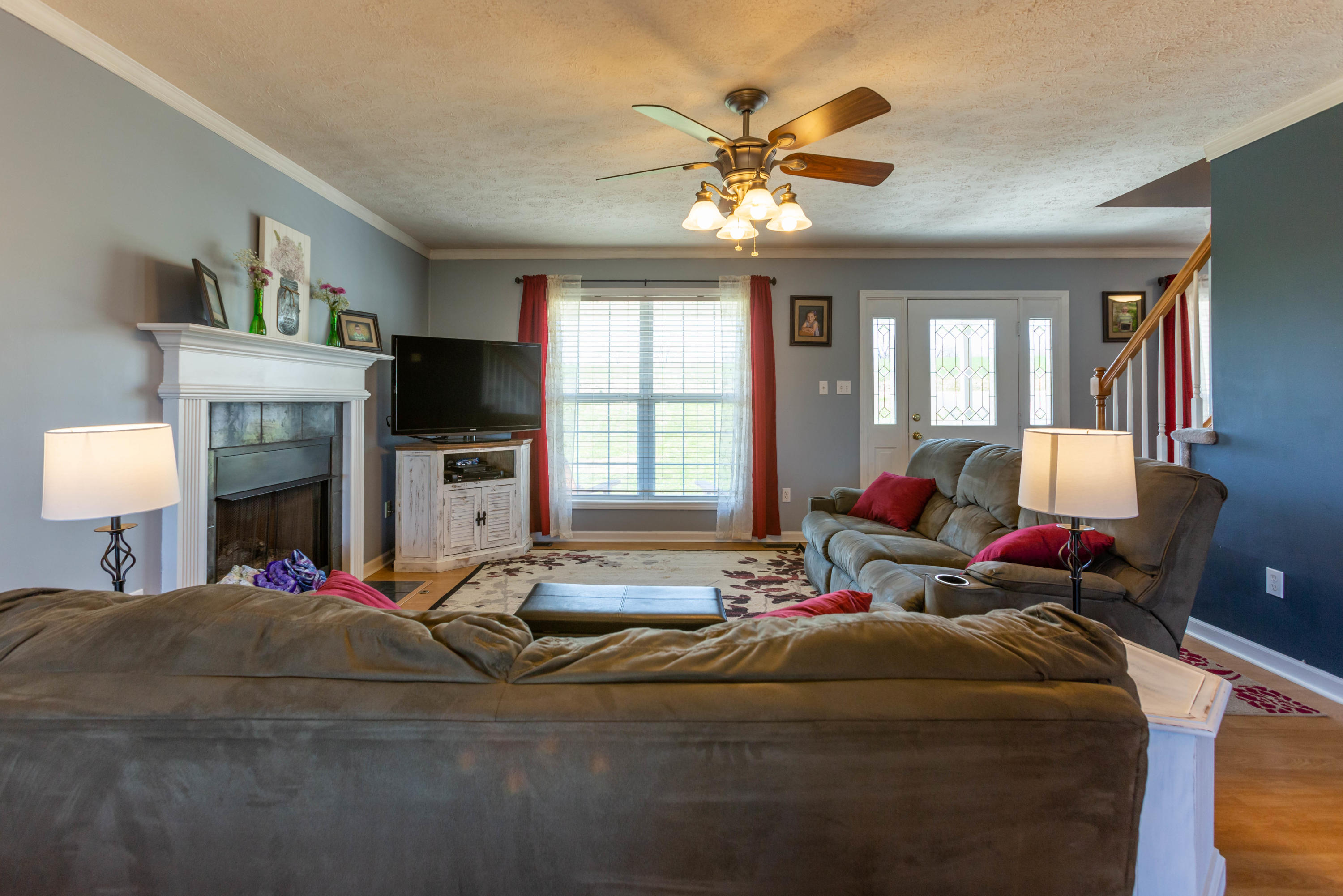 35 Blankenship Road Rocky Mount, VA 24151 - Photo 15 of 36 a living room with furniture a fireplace and a flat screen tv