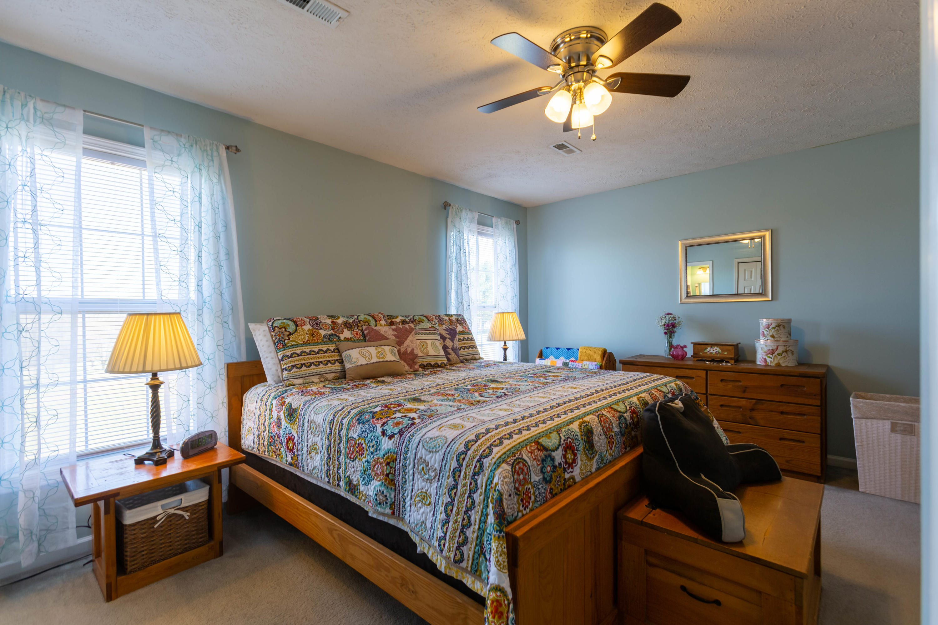 35 Blankenship Road Rocky Mount, VA 24151 - Photo 20 of 36 a bedroom with a bed and a chandelier