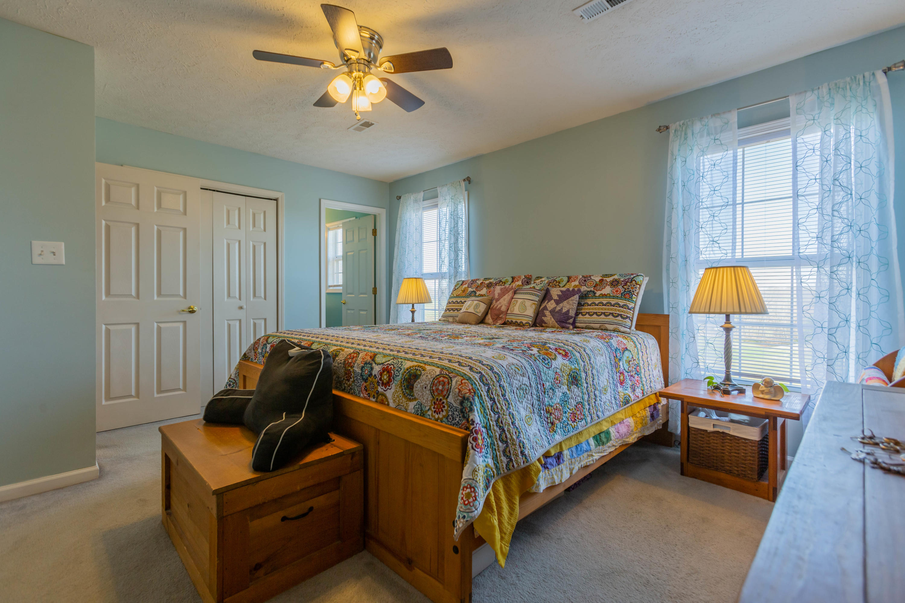 35 Blankenship Road Rocky Mount, VA 24151 - Photo 22 of 36 a bedroom with a bed and a chandelier