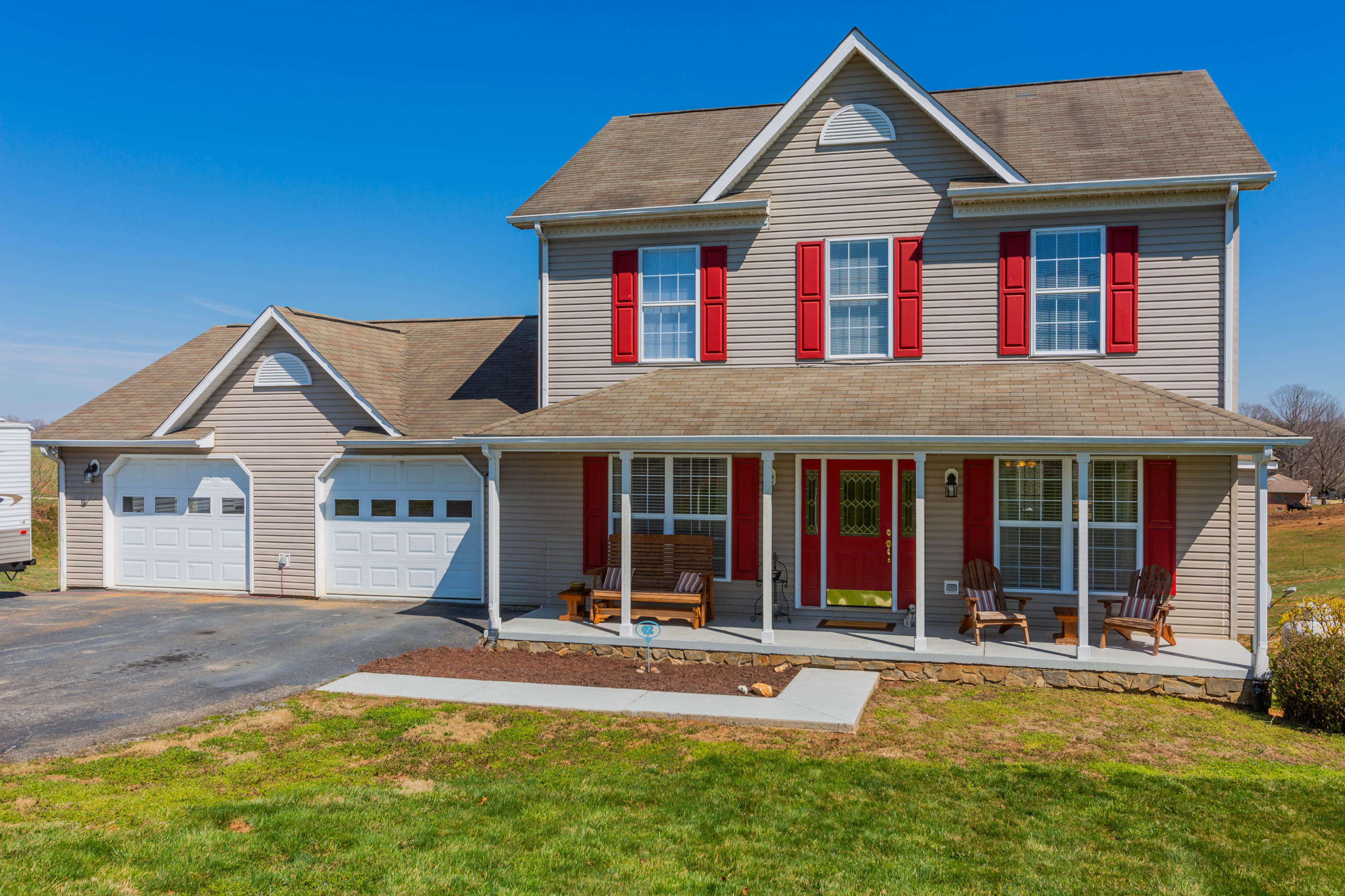 35 Blankenship Road Rocky Mount, VA 24151 - Photo 4 of 36 a front view of a house with a yard table and chairs