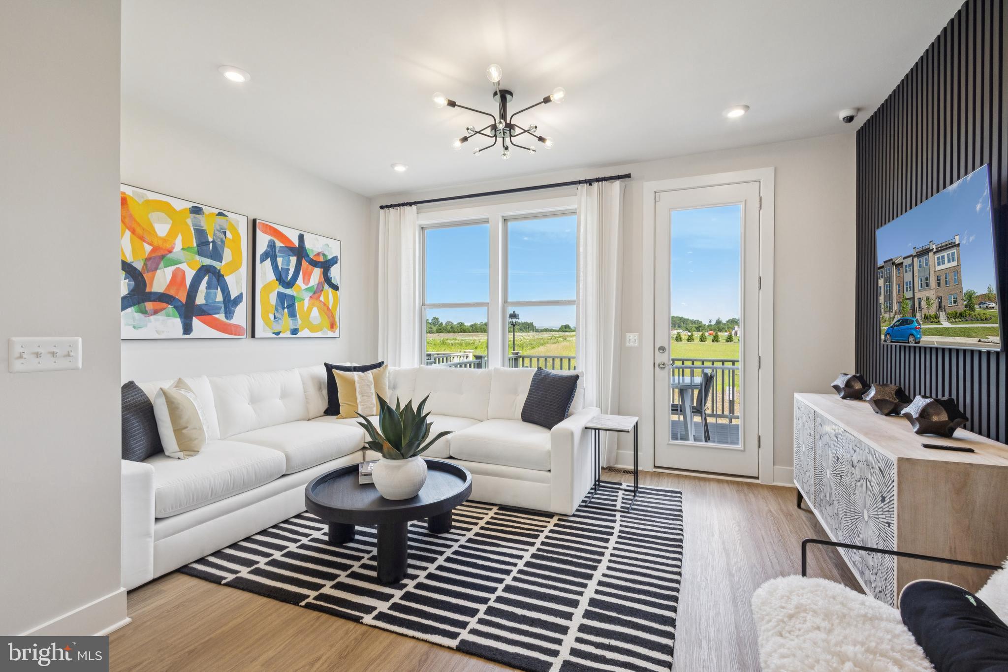 13722 Cobble Loop Woodbridge, VA 22193 - Photo 10 of 27 a living room with furniture and a flat screen tv