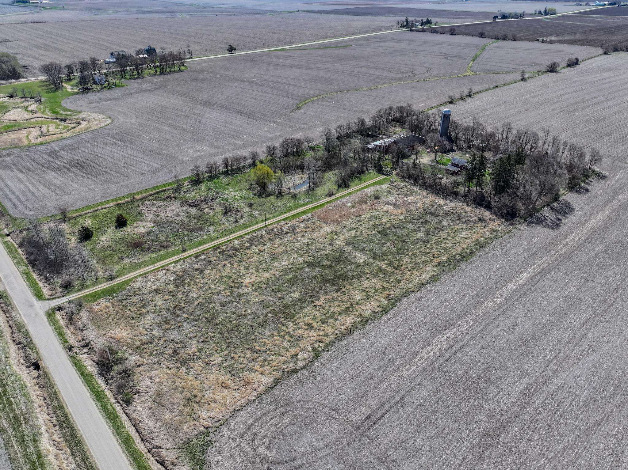 14189 East Dutch Road Rochelle, IL 61068 - Photo 5 of 65 a view of a yard with an outdoor space