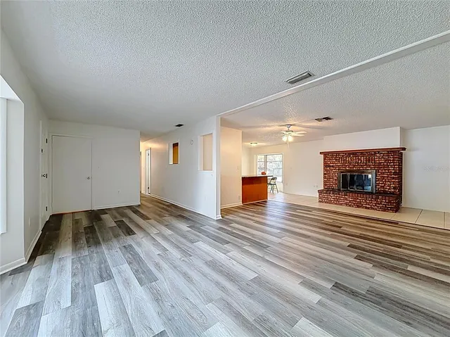 a kitchen with stainless steel appliances granite countertop a refrigerator sink and cabinets