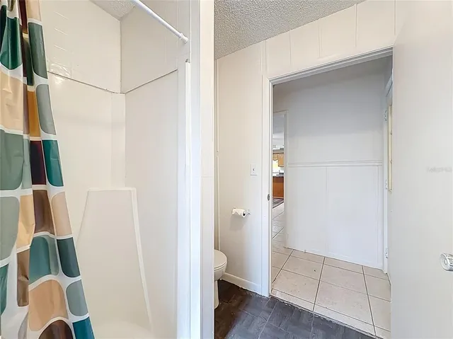 a view of room with window and ceiling fan