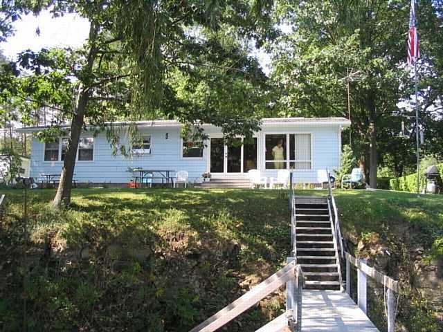 1297 Flint Road Torrey, NY 14527 - Photo 1 of 1 Exterior Front Minimal Step to Boat house and Shor