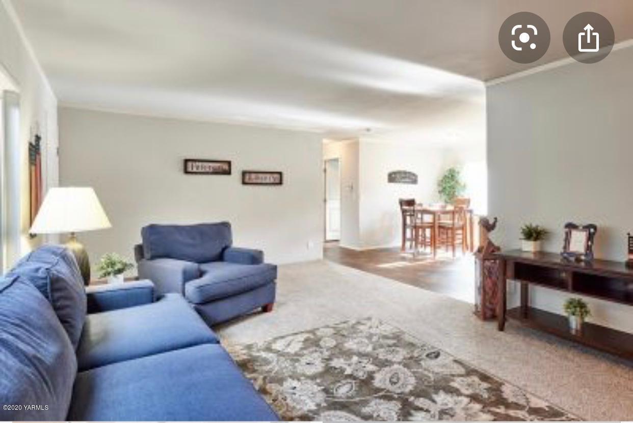 4857 7.8 Road Northeast, Unit 98837 Moses Lake, WA 98837 - Photo 3 of 5 a living room with furniture and wooden floor