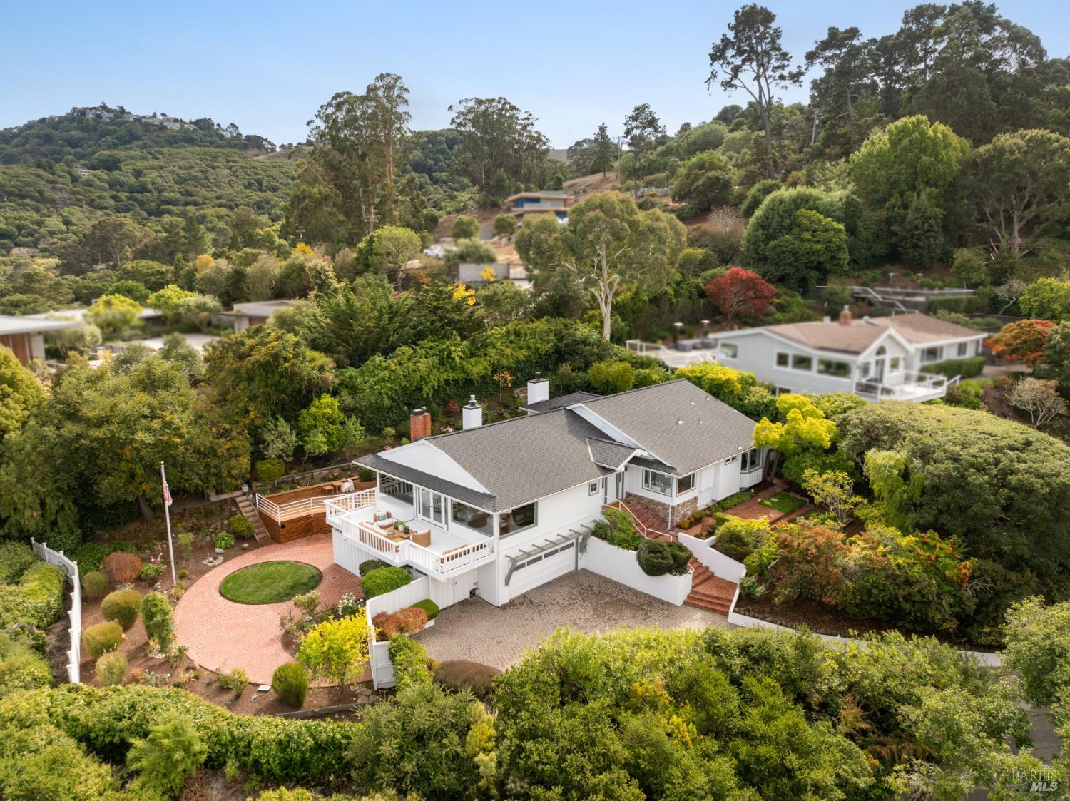 an aerial view of a house with a garden