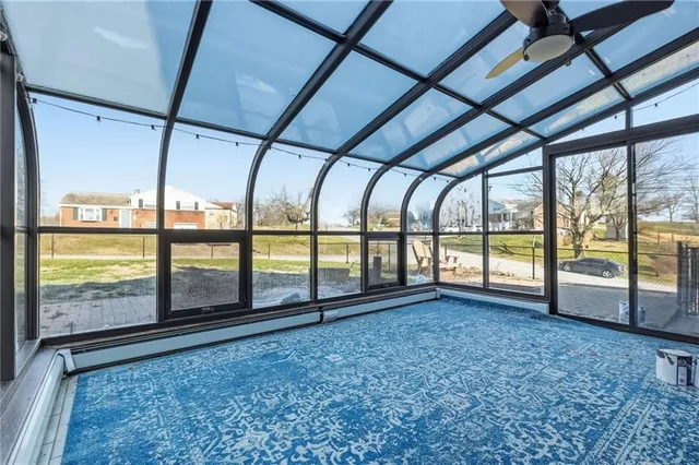 a view of an empty room with a large window