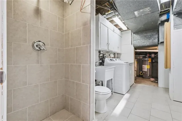a bathroom with a toilet sink and shower
