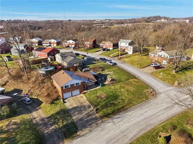 an aerial view of a house with a ocean view