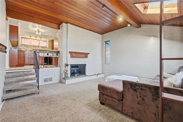 a bedroom with furniture and a fireplace