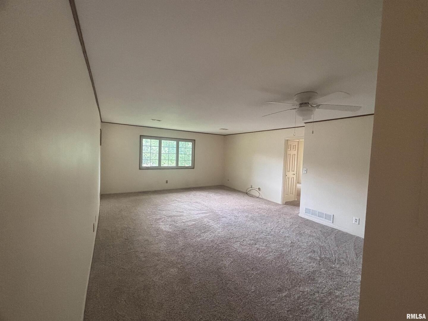 920 17th Street, Unit 28 Moline, IL 61265 - Photo 3 of 17 an empty room with windows and closet
