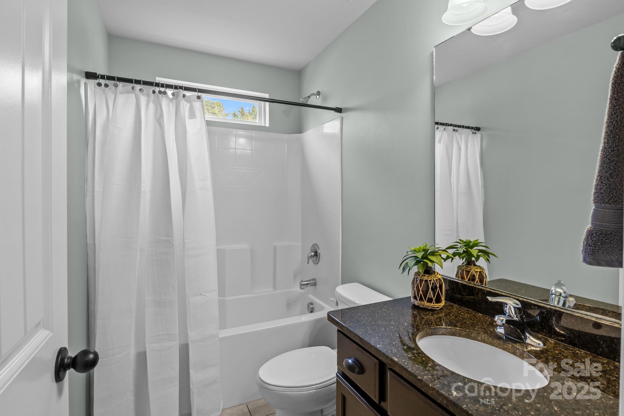 3427 Streamside Drive Davidson, NC 28036 - Photo 11 of 23 a bathroom with a granite countertop sink toilet and shower