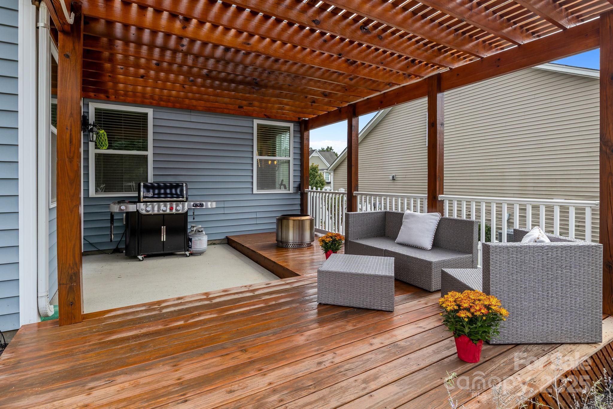 3427 Streamside Drive Davidson, NC 28036 - Photo 16 of 23 a outdoor living space with patio furniture and wooden floor