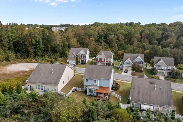 an aerial view of a house with mountain view