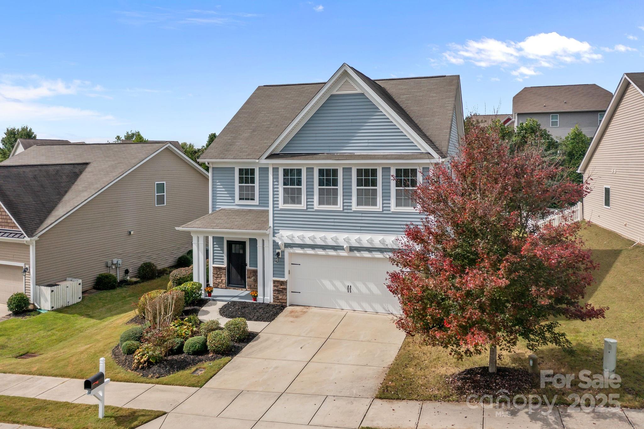3427 Streamside Drive Davidson, NC 28036 - Photo 21 of 23 a front view of a house with garden
