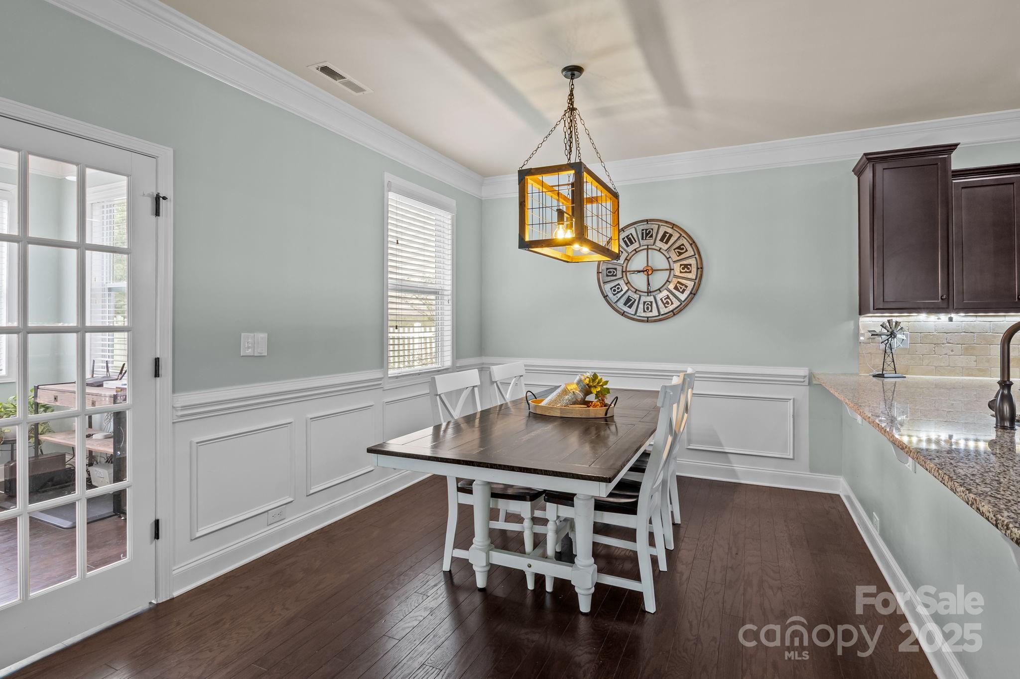 3427 Streamside Drive Davidson, NC 28036 - Photo 6 of 23 a table and chairs in a room with a window