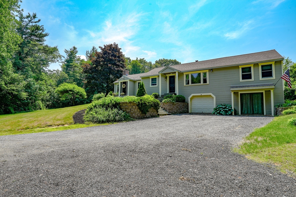 117 Main Street Rutland, MA 01543 - Photo 1 of 35 a front view of a house with garden