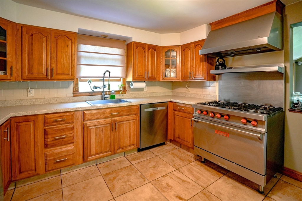 117 Main Street Rutland, MA 01543 - Photo 12 of 35 a kitchen with stainless steel appliances granite countertop a stove a sink and a refrigerator
