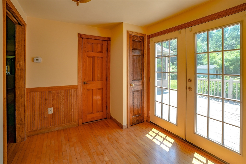 117 Main Street Rutland, MA 01543 - Photo 17 of 35 an empty room with wooden floor and windows
