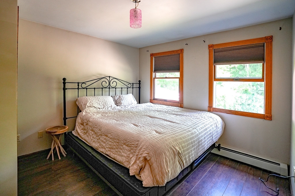 117 Main Street Rutland, MA 01543 - Photo 24 of 35 a large bed sitting in a bedroom next to a window