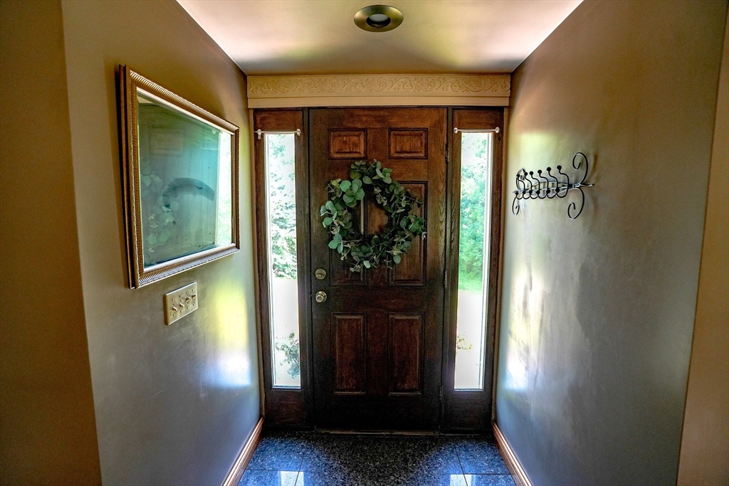 117 Main Street Rutland, MA 01543 - Photo 4 of 35 a view of a hallway with wooden floor and windows