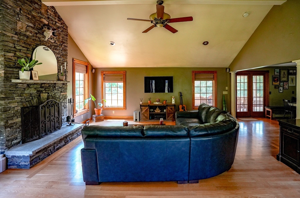 117 Main Street Rutland, MA 01543 - Photo 5 of 35 a living room with fireplace furniture and a wooden floor