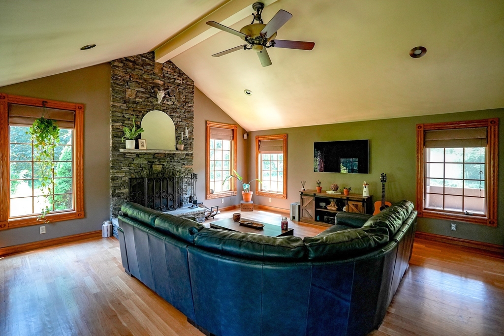 117 Main Street Rutland, MA 01543 - Photo 7 of 35 a living room with fireplace furniture and a flat screen tv