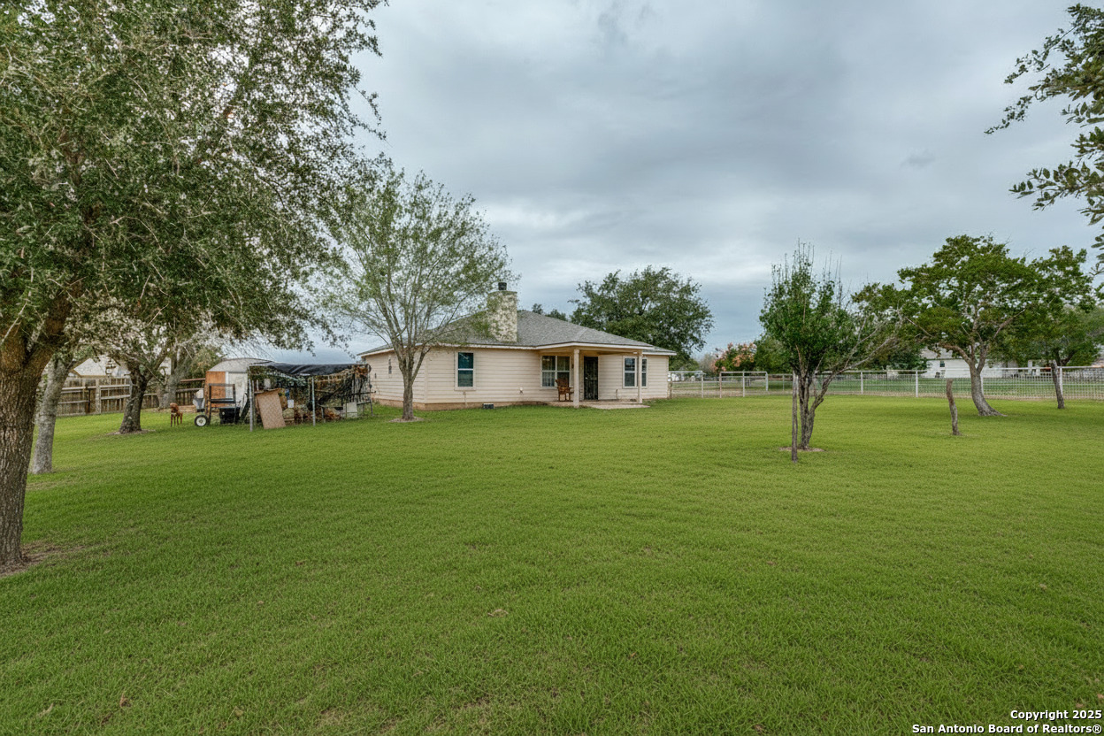 745 Cimarron Square Poteet, TX 78065 - Photo 28 of 33 a view of a house with a big yard