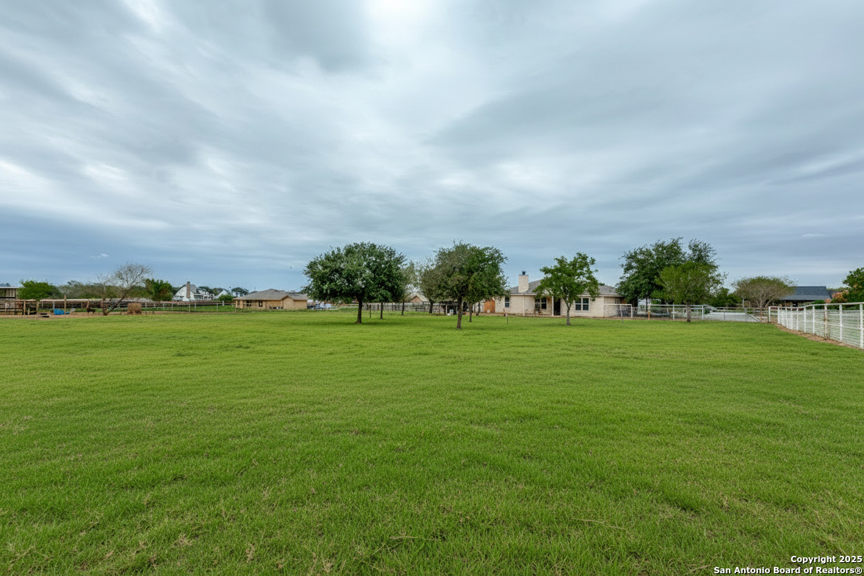 745 Cimarron Square Poteet, TX 78065 - Photo 30 of 33 a view of building with outdoor space