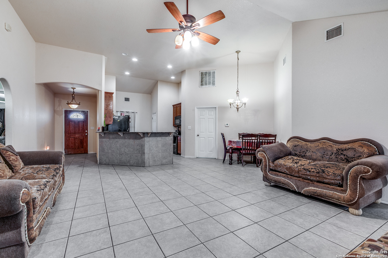 745 Cimarron Square Poteet, TX 78065 - Photo 10 of 33 a living room with furniture and kitchen view