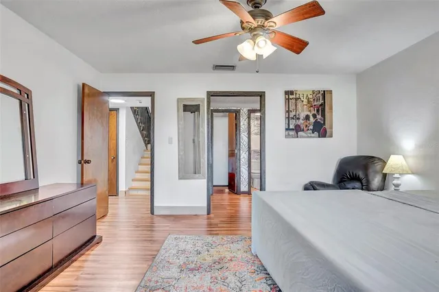 a room with a bed and a chandelier