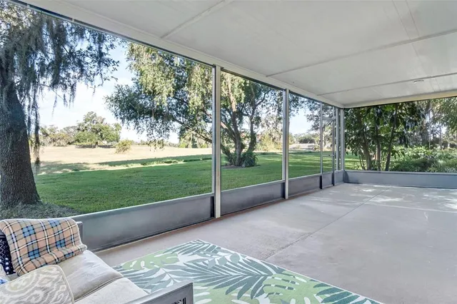 a view of a room with porch and wooden floor