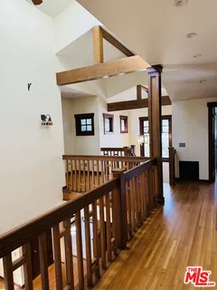 a view of a porch with wooden floor