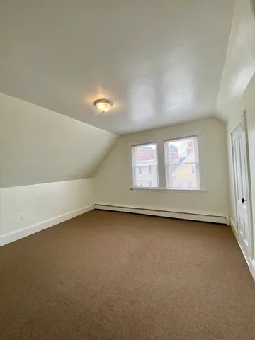 a view of a big room with windows