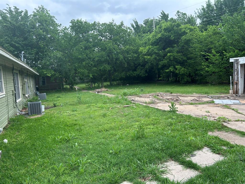 6 Pershing Drive Denison, TX 75020 - Photo 3 of 13 a view of a backyard
