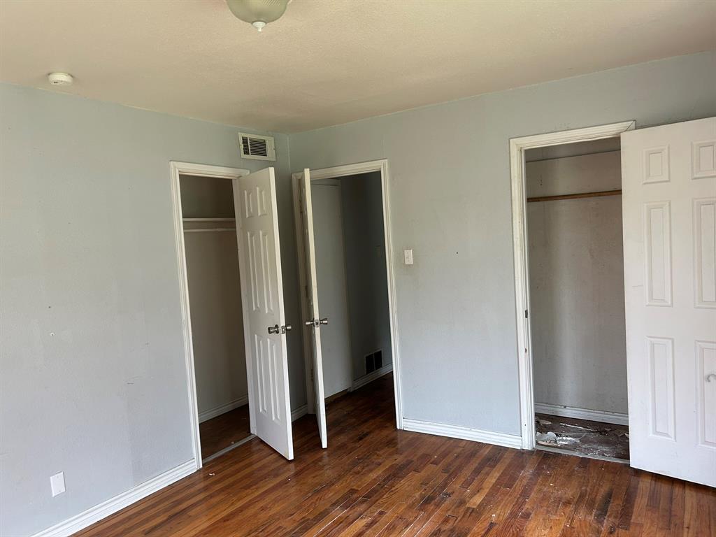 6 Pershing Drive Denison, TX 75020 - Photo 9 of 13 an empty room with wooden floor and closet