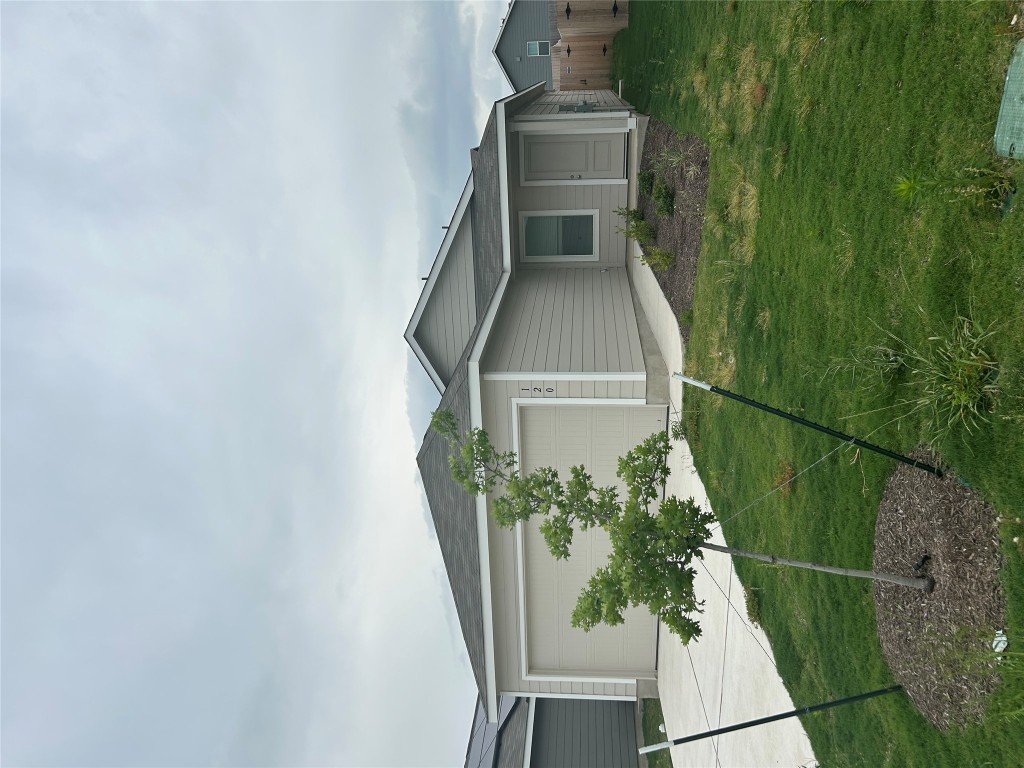 120 Cattle Queen Road Jarrell, TX 76537 - Photo 2 of 9 a house view with a garden space